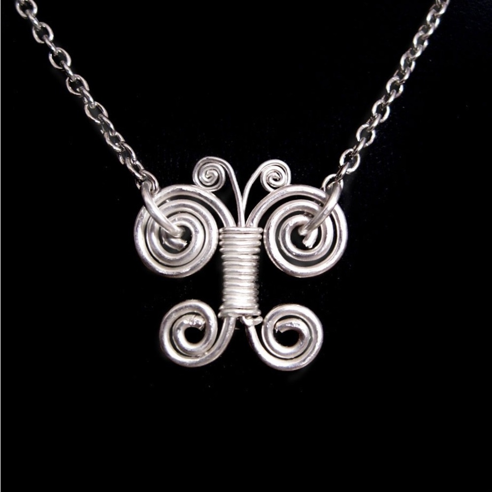 Handmade WireWrapped Sterling Silver Coil Butterfly on Sterling silver Chain.